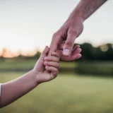 Dad and son holding hands, never met your father