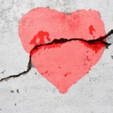 broken heart on the crumbling wall sibling trauma