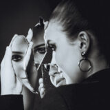 Black and white photo of beautiful woman with broken self- signs of childhood trauma in adults